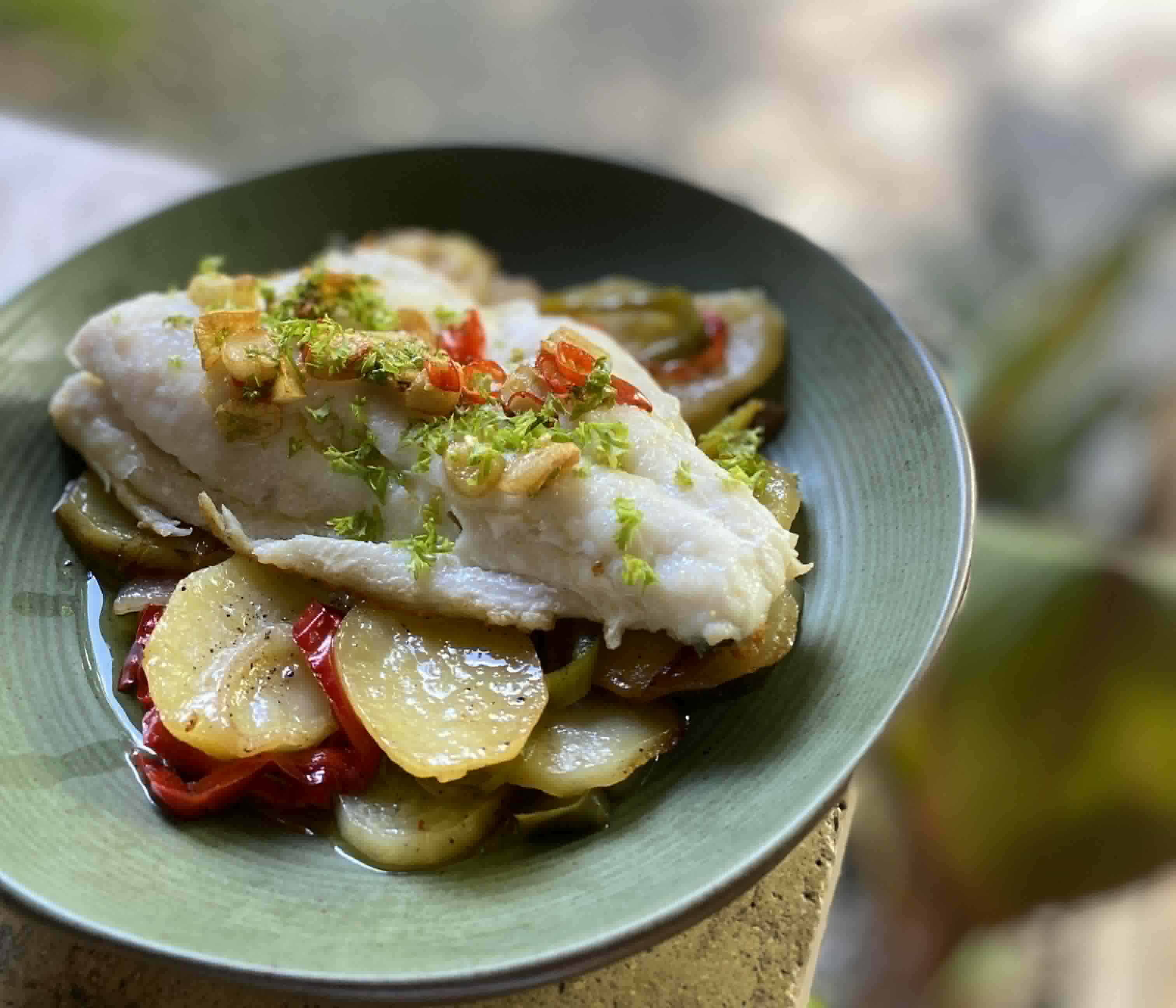 A plated fish dish at Amia’s Pizza House